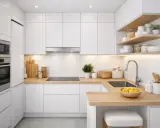Cuisine petit espace : rangements blancs, plan de travail en bois, électroménagers intégrés, étagères ouvertes avec bocaux et ustensiles.