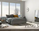 Une chambre apaisante avec un lit douillet, une pile de galets et le mot "FENG SHUI" en lettres métalliques.